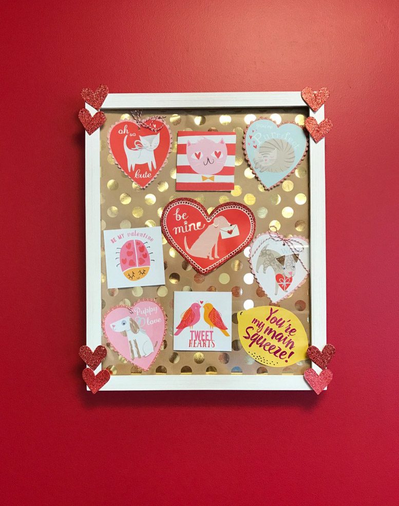 DIY collage made from Valentine's Day cards in white frame