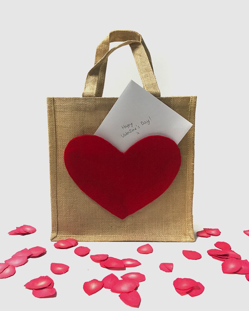 DIY burlap gift bag with red heart pocket and handwritten note