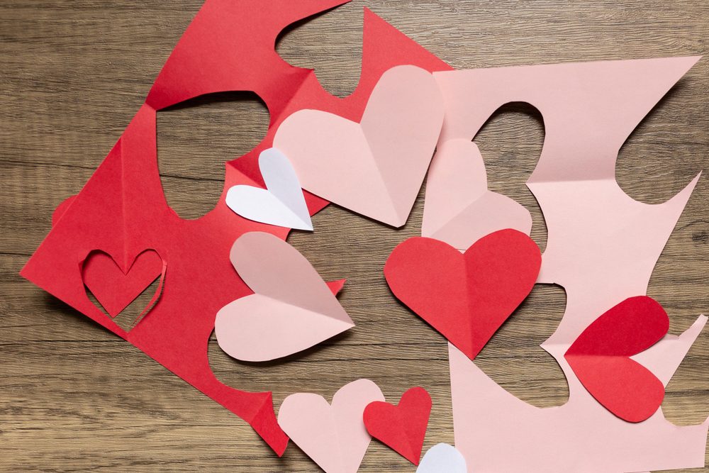 Red and pink hearts cut from paper for Valentine's Day craft